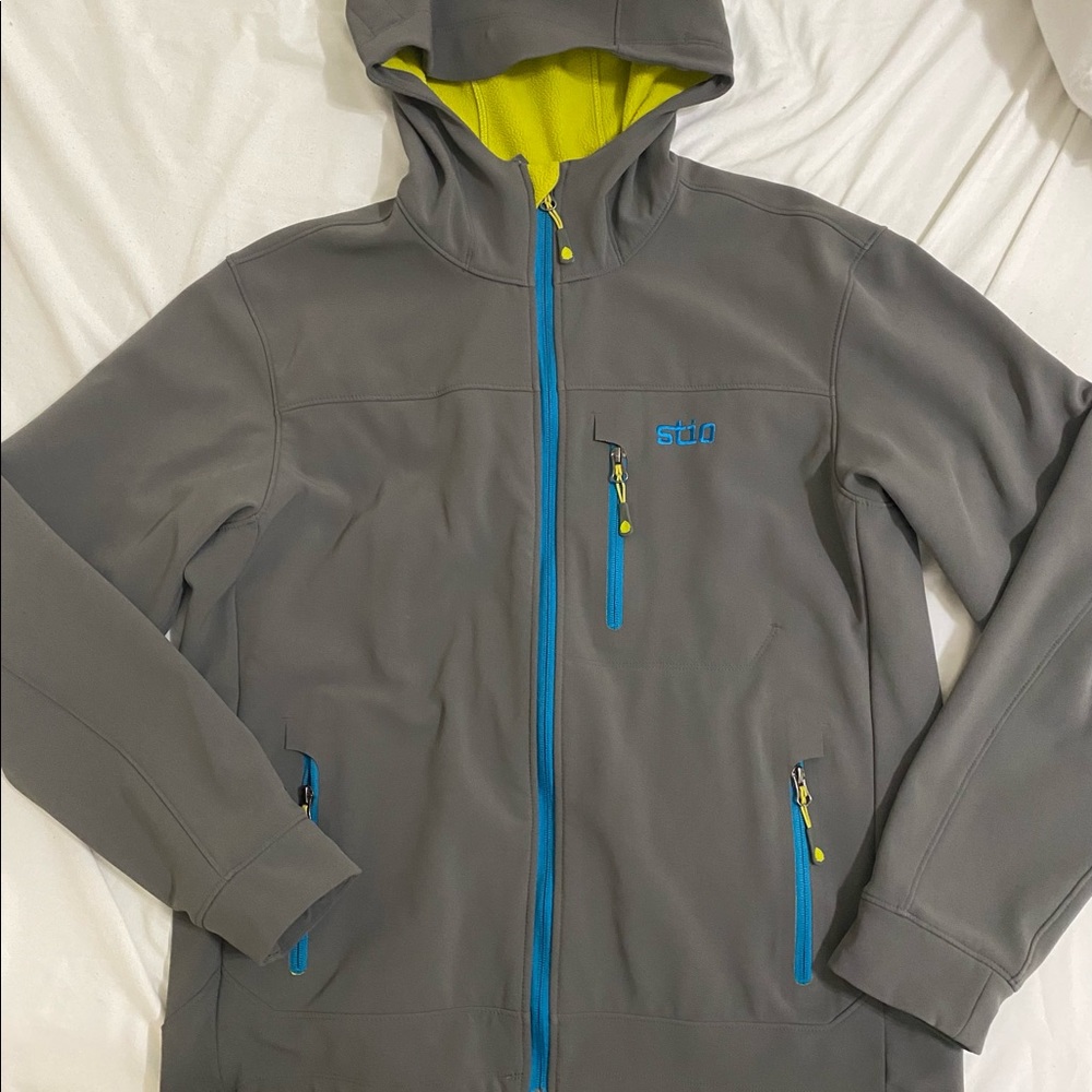 Stio Men’s grey, medium jacket. Lightweight, fleece lined hoodie style.